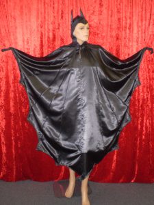 Black bat costume. Bat costume. Black dress with attached hood available to hire from our Sydney costume shop. Fits up to plus sizes.