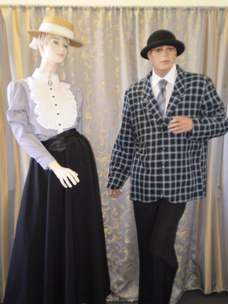 Male and female Edwardian day wear , old fashioned school teacher costumes