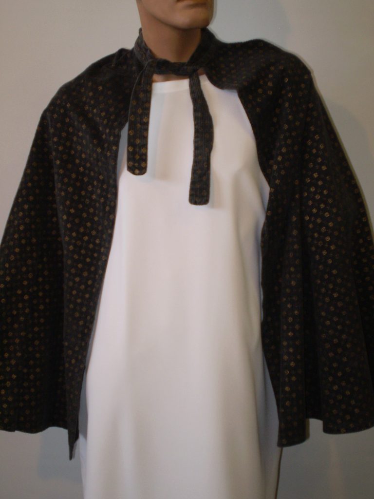 Black cape with gold print