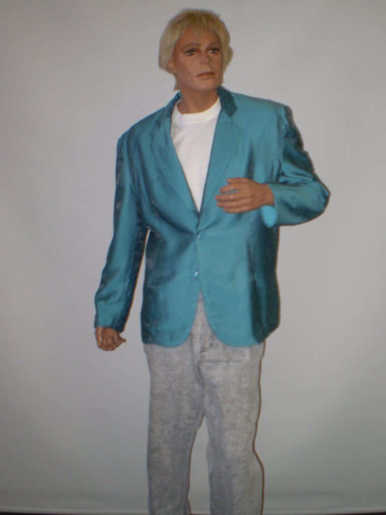 Blue eighties jacket, white t shirt and grey 80s pants