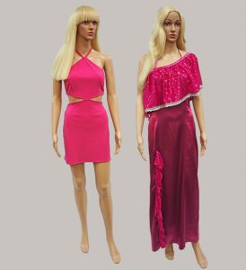Image shows 2 mannequins dressed as Barbie in pink gowns and blond wigs