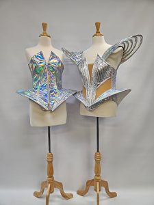 Image shows 2 mannequins wearing futuristic style silver corsets, available to hire from Acting the Part in Carlingford, Sydney.
