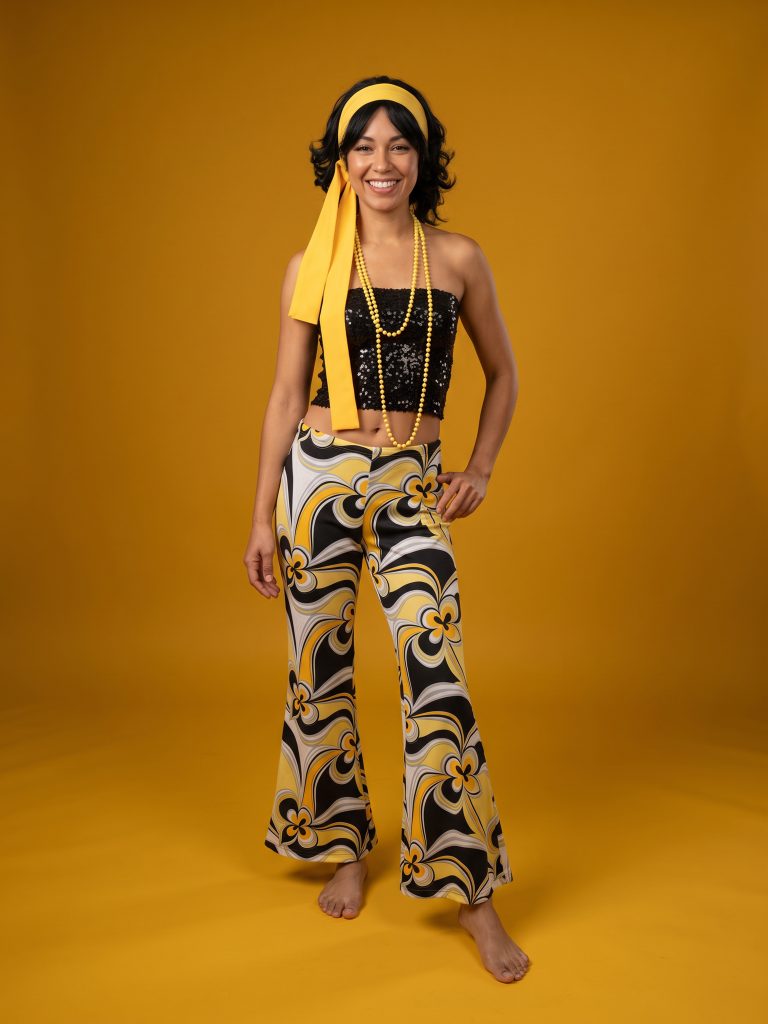 60s 70s costume with a sequin tube top and yellow patterned floral flares