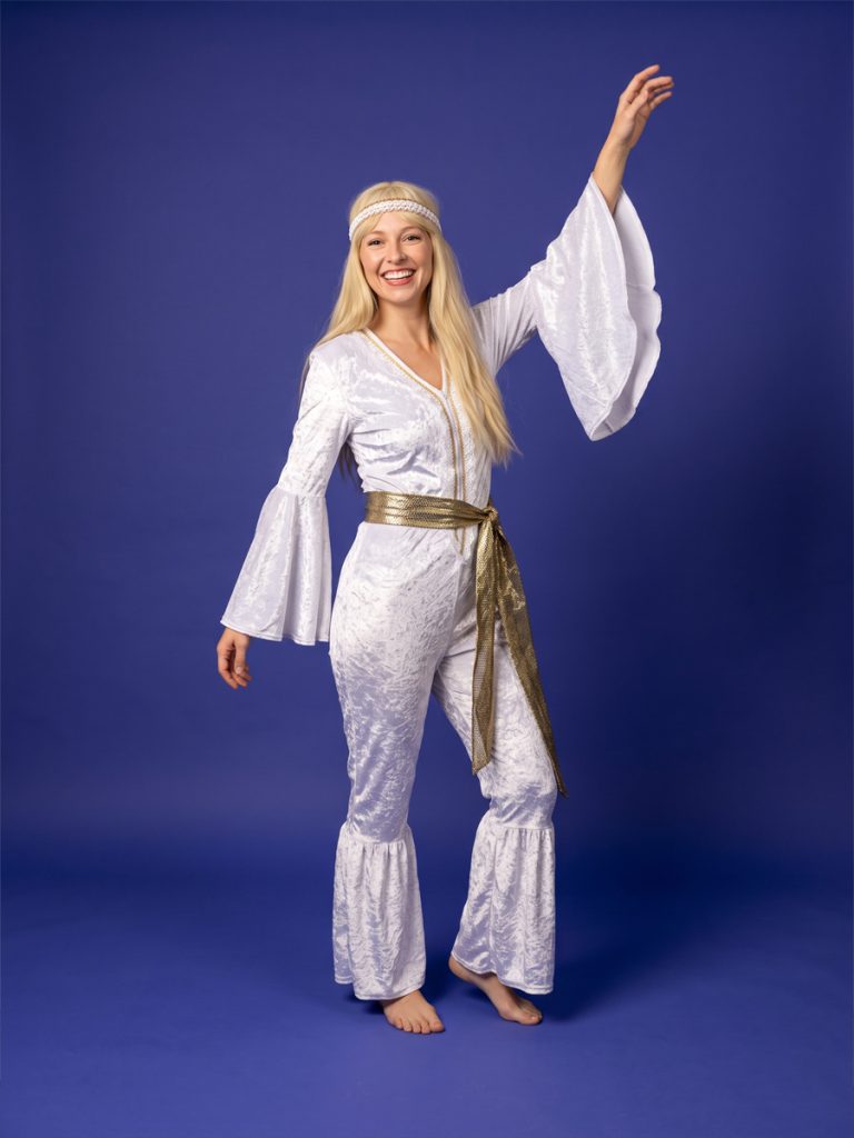 Model wearing a white Abba style jumpsuit