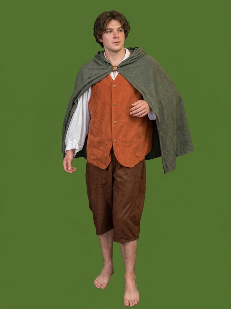 Frodo style costume including a green cape, rust coloured vest over white shirt and brown crop pants